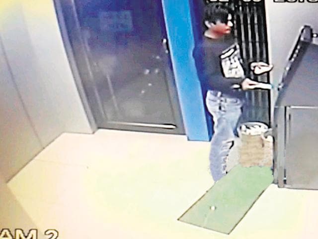 A screengrab from a Byculla ATM security camera footage shows the suspect making a withdrawal. A screengrab from a Byculla ATM security camera footage shows the suspect making a withdrawal.