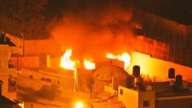 Palestinians set ablaze the Jewish shrine St Joseph’s Tomb in Nablus, West Bank as other incidents of violence continued to be reported across Israel. (Handout photo/Israel defence spokesperson) Palestinians set ablaze the Jewish shrine St Joseph’s Tomb in Nablus, West Bank as other incidents of violence continued to be reported across Israel. (Handout photo/Israel defence spokesperson)