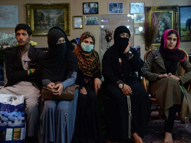 An Afghan family, who have been displaced from the northern Afghan city of Kunduz during clashes between Afghan security forces and Taliban insurgents, speak as they gather at a temporary shelter donated by a businessman at a hotel in Kabul. (AFP) An Afghan family, who have been displaced from the northern Afghan city of Kunduz during clashes between Afghan security forces and Taliban insurgents, speak as they gather at a temporary shelter donated by a businessman at a hotel in Kabul. (AFP)