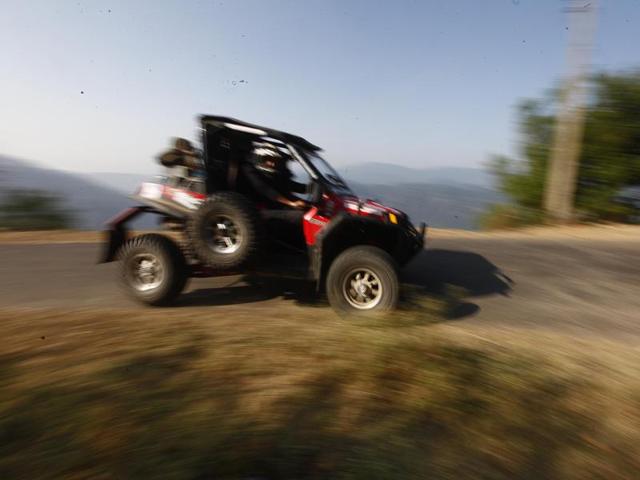 Bikers and car rally participants in their second leg on the second day of Raid De Himalaya Xtreme and Adventure car rally in Katindi. (Virendra Singh Gosain/HT Photo)