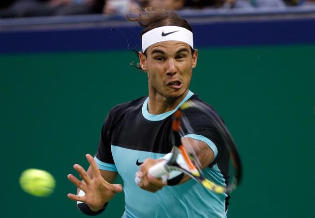 Rafael Nadal of Spain hits a return shot against Jo-Wilfried Tsonga of France during their semifinal match of the Shanghai Masters tennis tournament in Shanghai, China, Saturday. (AP Photo) Rafael Nadal of Spain hits a return shot against Jo-Wilfried Tsonga of France during their semifinal match of the Shanghai Masters tennis tournament in Shanghai, China, Saturday. (AP Photo)