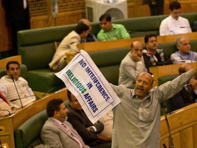 Engineer Rashid, an independent legislator, holds a banner as he disrupts the first day of Jammu and Kashmir state’s autumn assembly session in Srinagar. (AP Photo) Engineer Rashid, an independent legislator, holds a banner as he disrupts the first day of Jammu and Kashmir state’s autumn assembly session in Srinagar. (AP Photo)