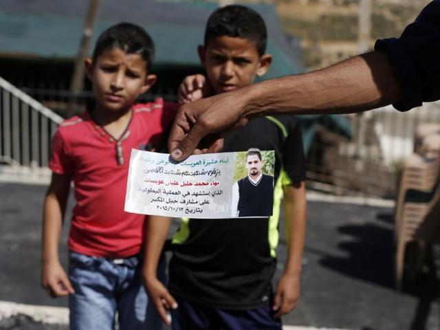 The father of Bahaa Allyan, who was killed by Israeli police after shooting three Israelis on a bus in Jerusalem earlier in the week, holds a photo of his son at his home in the Palestinian neighbourhood of Jabal Mukaber in east Jerusalem. (AFP) The father of Bahaa Allyan, who was killed by Israeli police after shooting three Israelis on a bus in Jerusalem earlier in the week, holds a photo of his son at his home in the Palestinian neighbourhood of Jabal Mukaber in east Jerusalem. (AFP)