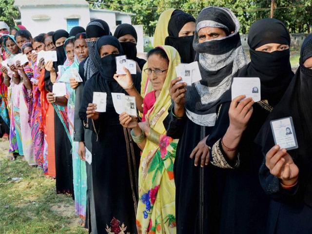Voters wait in queues to cast their vote during second phase of Bihar elections at Gaya on Friday. (PTI) Voters wait in queues to cast their vote during second phase of Bihar elections at Gaya on Friday. (PTI)