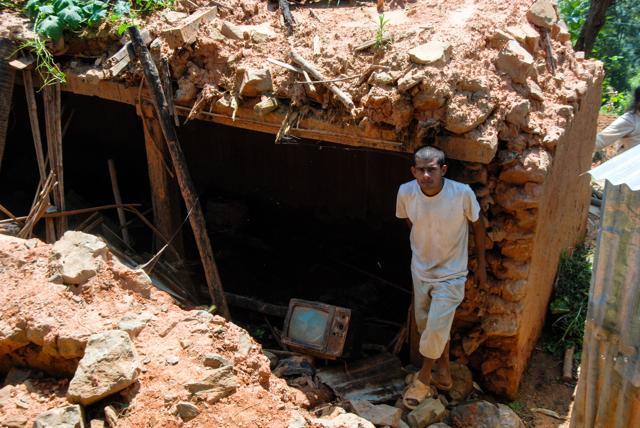 Sitaram Adhikari lost his two-storey mud house to the earthquake. He says that his father couldn’t bear the loss and committed suicide. The nine-members in his family now live in a tin shelter. (Furquan Ameen Siddiqui/ HT Photo) Sitaram Adhikari lost his two-storey mud house to the earthquake. He says that his father couldn’t bear the loss and committed suicide. The nine-members in his family now live in a tin shelter. (Furquan Ameen Siddiqui/ HT Photo)