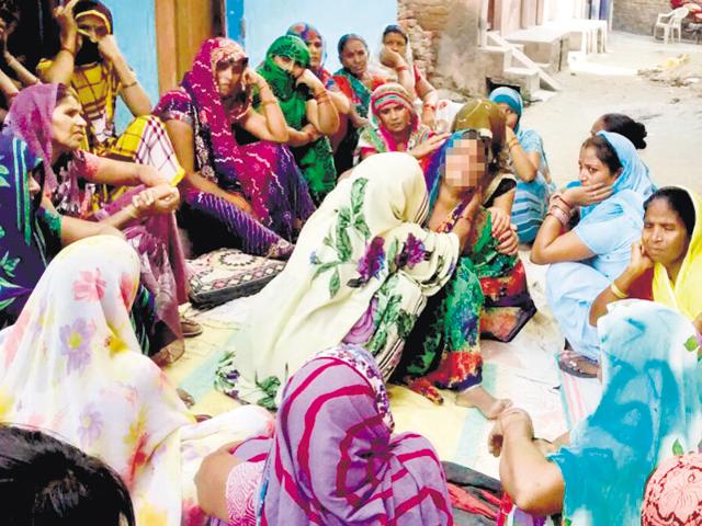 The family and neighbours of the 17-year-old girl who committed suicide after alleged repeated harassment in Noida on Saturday.(HT Photo) The family and neighbours of the 17-year-old girl who committed suicide after alleged repeated harassment in Noida on Saturday.(HT Photo)