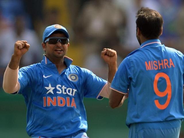India's Suresh Raina, left, celebrates with Amit Mishra after the dismissal of South Africa's batsman Hashim Amla. (AFP Photo) India's Suresh Raina, left, celebrates with Amit Mishra after the dismissal of South Africa's batsman Hashim Amla. (AFP Photo)