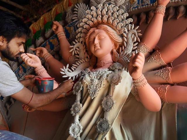 Divine intervention: There is something special about Pujo in Calcutta- the city metamorphoses into a magical place when the Goddess comes calling (Photo by Manvender Vashist)(PTI) Divine intervention: There is something special about Pujo in Calcutta- the city metamorphoses into a magical place when the Goddess comes calling (Photo by Manvender Vashist)(PTI)