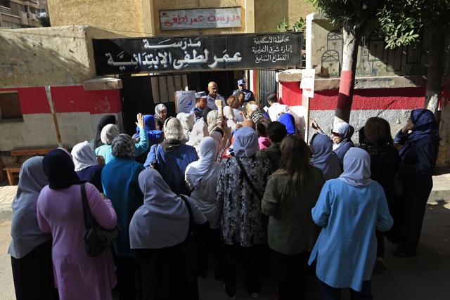 Egyptians women wait to cast their votes outside a polling station during the first round of the Egyptian parliamentary elections, in Alexandria, Egypt. (AP Photo) Egyptians women wait to cast their votes outside a polling station during the first round of the Egyptian parliamentary elections, in Alexandria, Egypt. (AP Photo)