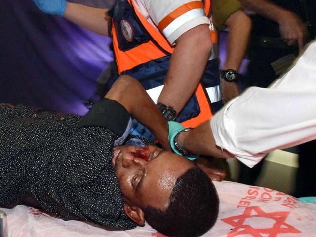 A wounded Eritrean man who later died of his wounds, is evacuated at the main bus station in the southern Israeli city of Beersheva on October 18, 2015, after he was mistakenly shot by an Israeli security guard and beaten by a mob during an attack. (AFP Photo) A wounded Eritrean man who later died of his wounds, is evacuated at the main bus station in the southern Israeli city of Beersheva on October 18, 2015, after he was mistakenly shot by an Israeli security guard and beaten by a mob during an attack. (AFP Photo)