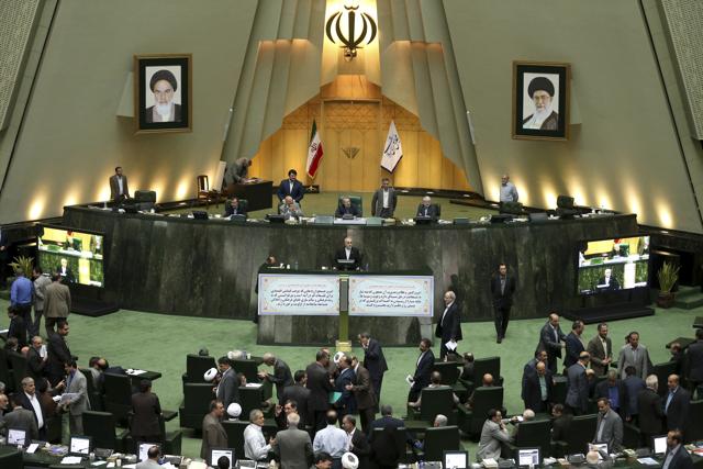 Head of Iran's Atomic Energy Organization Ali Akbar Salehi, centre, speaks in an open session of parliament while discussing a bill on Iran's nuclear deal with world powers, in Tehran. The bill was achieved after more than two years of close negotiations between Iran and the United States. (AP Photo) Head of Iran's Atomic Energy Organization Ali Akbar Salehi, centre, speaks in an open session of parliament while discussing a bill on Iran's nuclear deal with world powers, in Tehran. The bill was achieved after more than two years of close negotiations between Iran and the United States. (AP Photo)
