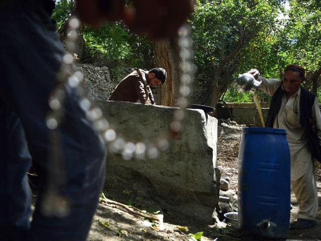 A local resident pours the juice from crushed grapes as part of a brewing wine process in a garden in the remote village of Sher Qilla in Punyal valley in northern Pakistan. (AFP) A local resident pours the juice from crushed grapes as part of a brewing wine process in a garden in the remote village of Sher Qilla in Punyal valley in northern Pakistan. (AFP)