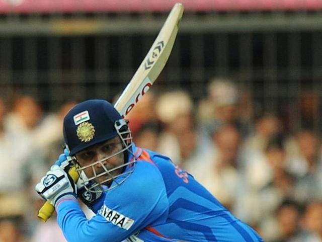 Sehwag plays a shot on the way to scoring a double century during the fourth ODI against West Indies. (AFP Photo)