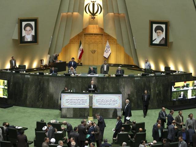 Head of Iran's Atomic Energy Organization Ali Akbar Salehi, center, speaks in an open session of parliament while discussing a bill on Iran's nuclear deal with world powers, in Tehran, Iran.(AP Photo)