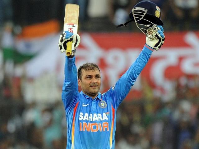 Sehwag celebrates his double century during the fourth ODI against West Indies in Indore, on December 8, 2011. (AFP Photo)