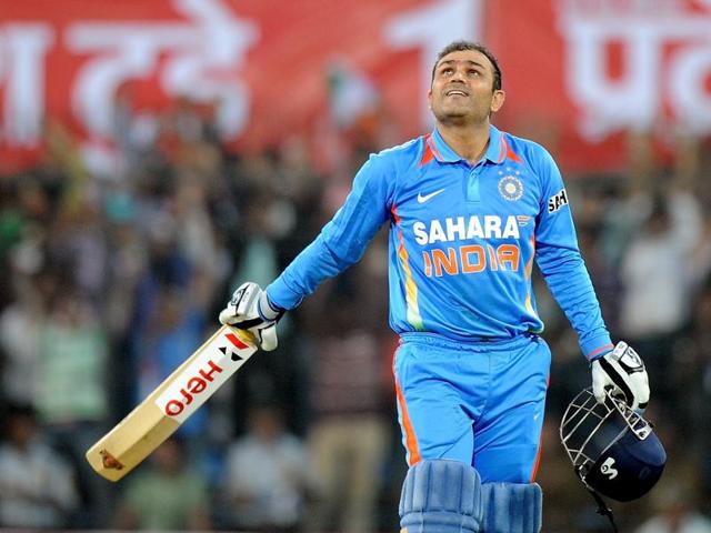 (FILES) In this photograph taken on December 8, 2011, Indian batsman Virender Sehwag looks up as he celebrates scoring a double century (200 runs) during the fourth one-day international cricket match between India and West Indies at The Holkar Stadium in Indore.(AFP) (FILES) In this photograph taken on December 8, 2011, Indian batsman Virender Sehwag looks up as he celebrates scoring a double century (200 runs) during the fourth one-day international cricket match between India and West Indies at The Holkar Stadium in Indore.(AFP)