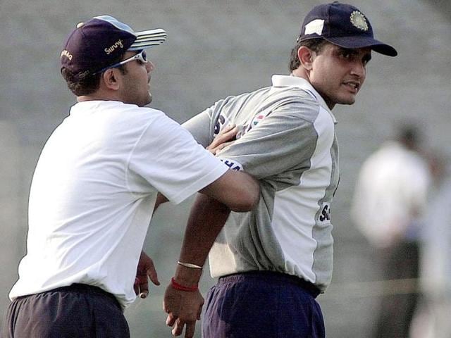 Virender Sehwag helps to stretch Indian captain Sourav Ganguly during the net practice at Eden Gardens in Calcutta, 17 January 2002. (AFP)