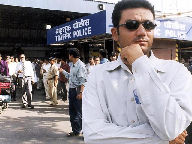 Indian batting sensaiton Virender Sehwag waits for the trasport outside the Bombay airport 01 October, 2002. (AFP)