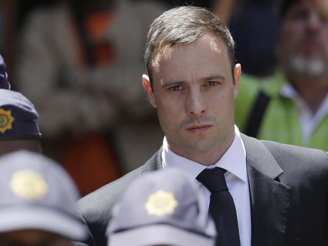 Oscar Pistorius sits in court in Pretoria after being sentenced to five years imprisonment for culpable homicide, on October 21, 2014.(AP Photo)