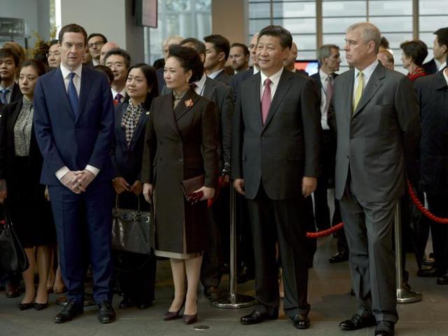 Britain's Chancellor George Osborne (L) lines up with and China's President Xi Jinping, his wife Peng Liyuan, and Prince Andrew (R) during a visit to Imperial College in London. (REUTERS) Britain's Chancellor George Osborne (L) lines up with and China's President Xi Jinping, his wife Peng Liyuan, and Prince Andrew (R) during a visit to Imperial College in London. (REUTERS)