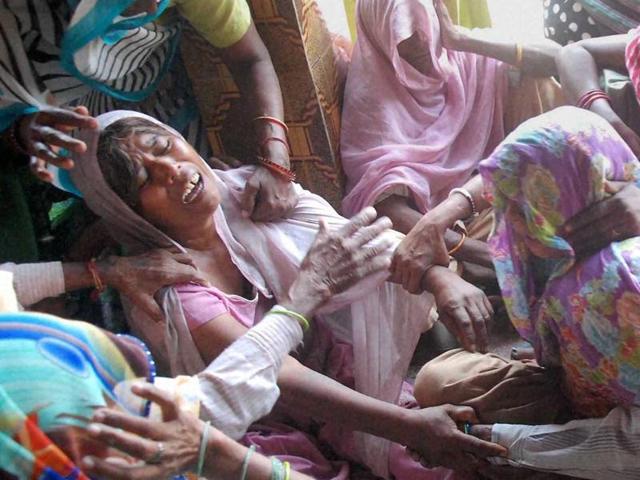 Relatives of the victims, crying after the house of a dalit was set on fire at Ballabgarh, in Faridabad .(PTI Photo)