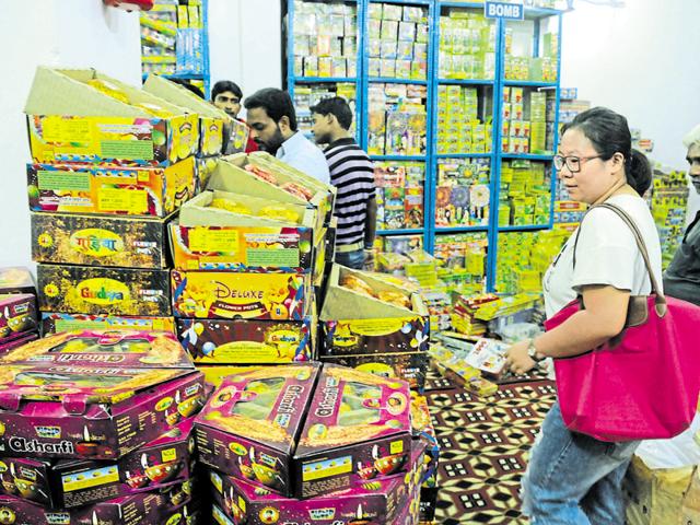 A customer shops for firecrackers at a wholesale shop in village Gadoli on Tuesday. (Parveen Kumar/HT Photo) A customer shops for firecrackers at a wholesale shop in village Gadoli on Tuesday. (Parveen Kumar/HT Photo)