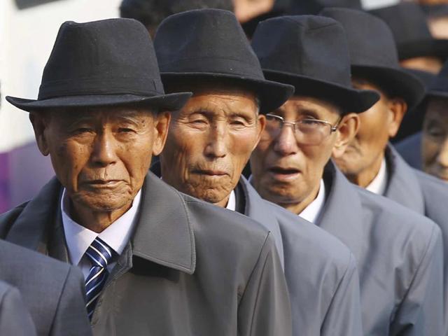 North Korean elderly men wait to meet their South Korean family members during the reunion at Diamond Mountain resort in North Korea. (AP Photo)