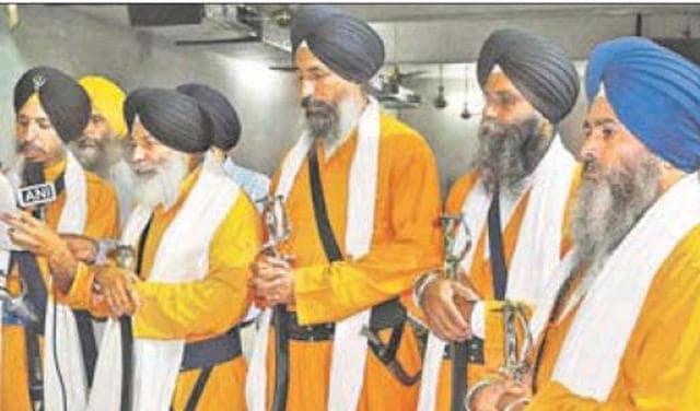 The SGPC designates the ‘Panj Pyaras’ (above) officially to perform the ‘amrit sanchar’ (baptism) ceremony and leading ‘nagar kirtans’ (religious processions) on important occasions.(HT Photo) The SGPC designates the ‘Panj Pyaras’ (above) officially to perform the ‘amrit sanchar’ (baptism) ceremony and leading ‘nagar kirtans’ (religious processions) on important occasions.(HT Photo)