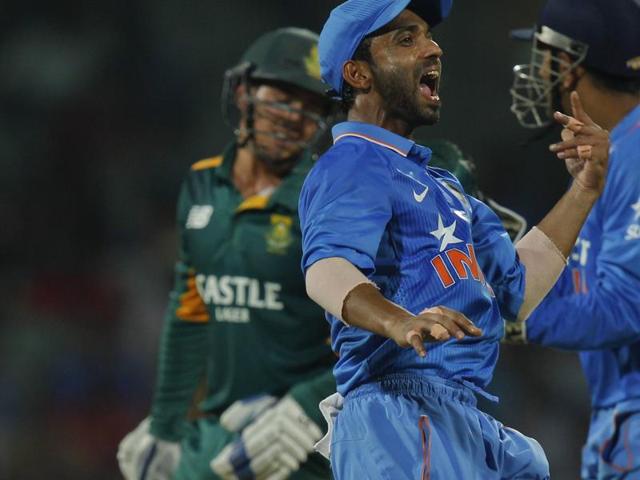 India's Ajinkya Rahane, center, celebrates after taking a catch to dismiss Quinton de Kock, left. (AP Photo)