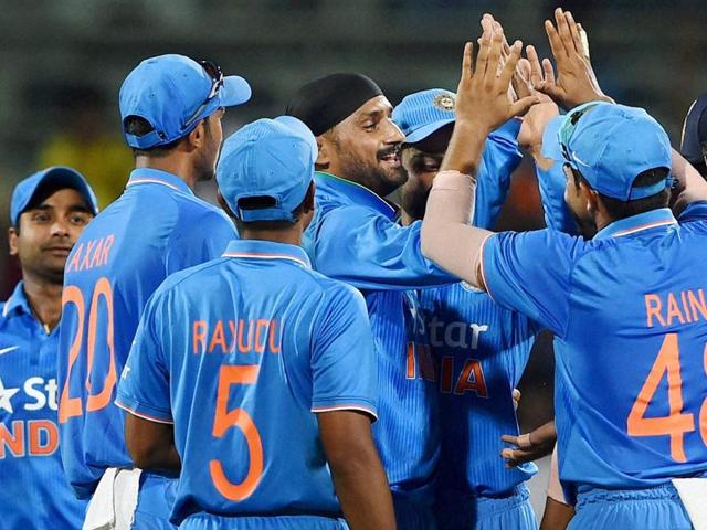 India's Harbhajan Singh celebrates with teammates after taking the wicket of South Africa's Quinton de Kock during the 4th ODI at MA Chidambaram Stadium in Chennai on October 22, 2015. (PTI Photo)