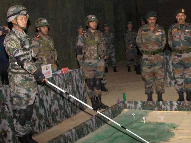 Indian and Chinese troops during the ‘Hand in Hand’ exercise in Kunming, China, on Wednesday. (PTI) Indian and Chinese troops during the ‘Hand in Hand’ exercise in Kunming, China, on Wednesday. (PTI)