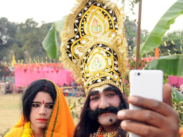 Artists taking a selfie during the Dussehra festival in Jalandhar on Thursday. (Pardeep Pandit/Ht Photo)
