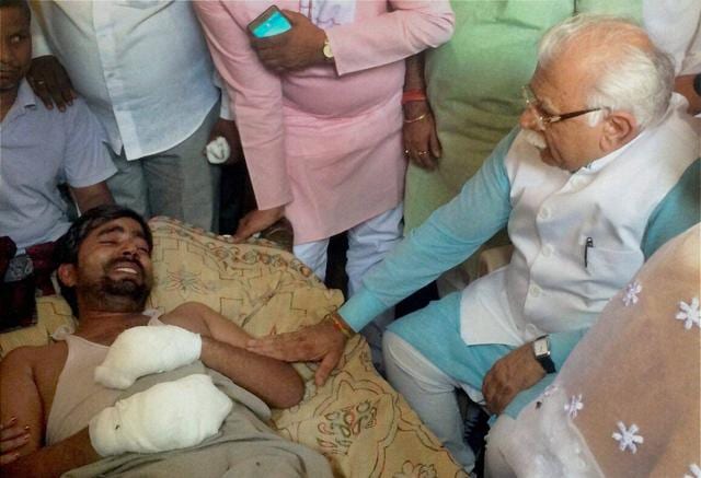 Haryana Chief Minister Manohar Lal Khattar meeting Jitendra whose house was set on fire allegedly by men belonging to the upper-cast community at Superh village in Ballabhgargh in Faridabad on Thursday.(PTI) Haryana Chief Minister Manohar Lal Khattar meeting Jitendra whose house was set on fire allegedly by men belonging to the upper-cast community at Superh village in Ballabhgargh in Faridabad on Thursday.(PTI)