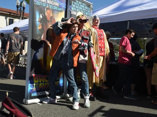 Back To The Future fans dressed as Jennifer, Marty and Doc during the franchise’s 30th anniversary celebrations. (AP)