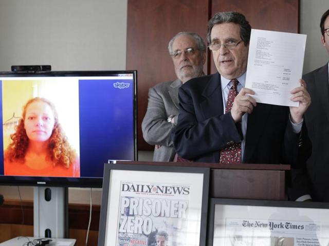 Attorney Norman Siegel (C), along with Udi Ofer (R), executive director of the American Civil Liberties Union of New Jersey and attorney Steven Hyman, answer questions during a news conference, in New York. The ACLU along with two New York law firms, will be representing Kaci Hickox (L) seen via Skype, in filing a lawsuit against governor Chris Christie. (AP Photo) Attorney Norman Siegel (C), along with Udi Ofer (R), executive director of the American Civil Liberties Union of New Jersey and attorney Steven Hyman, answer questions during a news conference, in New York. The ACLU along with two New York law firms, will be representing Kaci Hickox (L) seen via Skype, in filing a lawsuit against governor Chris Christie. (AP Photo)