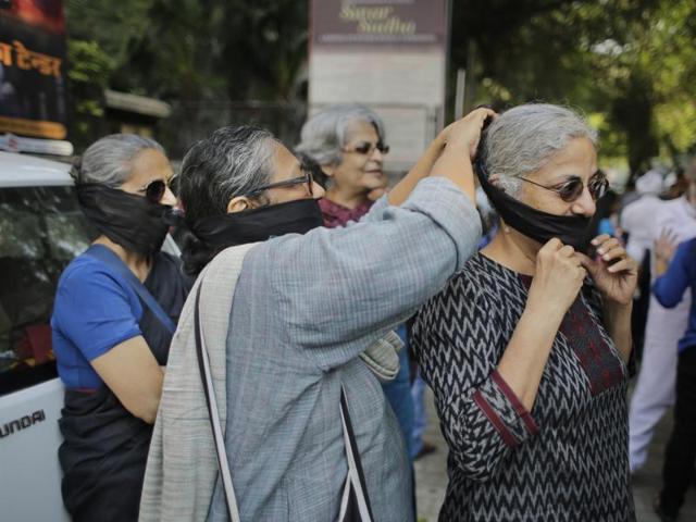 Writer participate in a silent protest march outside Sahitya Akademi in New Delhi. (AP Photo) Writer participate in a silent protest march outside Sahitya Akademi in New Delhi. (AP Photo)