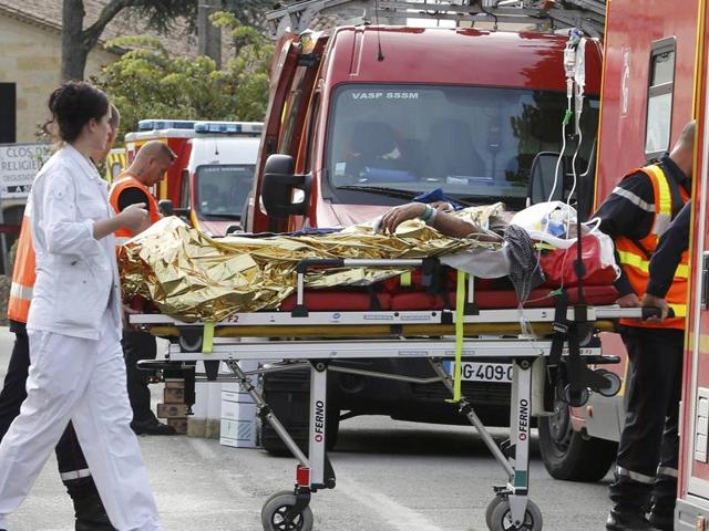 Rescue workers carry an injured person on a stretcher near the site where a coach carrying members of an elderly people’s club collided with a truck outside Puisseguin near Bordeaux. (AFP) Rescue workers carry an injured person on a stretcher near the site where a coach carrying members of an elderly people’s club collided with a truck outside Puisseguin near Bordeaux. (AFP)