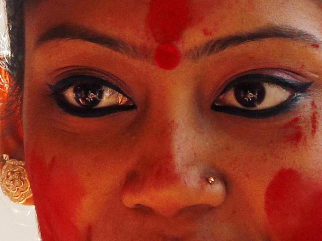 ’Kajal’ and ‘sindoor’ , or kohl and vermillion, are the colours of the day at “Sindoor Khela “ on Durga Puja's last day Bijoya Dashami at a Durga Puja Pandal at CR Park, in New Delhi, India, on Friday, October 23, 2015. (Ravi Choudhary/Hindustan Times)