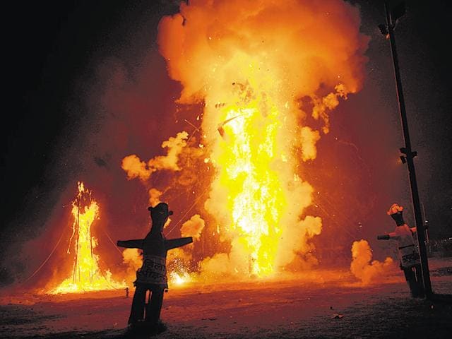 Effigies of Ravan, Kumbhkarana and Meghnath on the night of Dussehra at the Ramlila ground in Sector 21, Noida on Thursday. (Burhaan Kinu/HT Photo) Effigies of Ravan, Kumbhkarana and Meghnath on the night of Dussehra at the Ramlila ground in Sector 21, Noida on Thursday. (Burhaan Kinu/HT Photo)