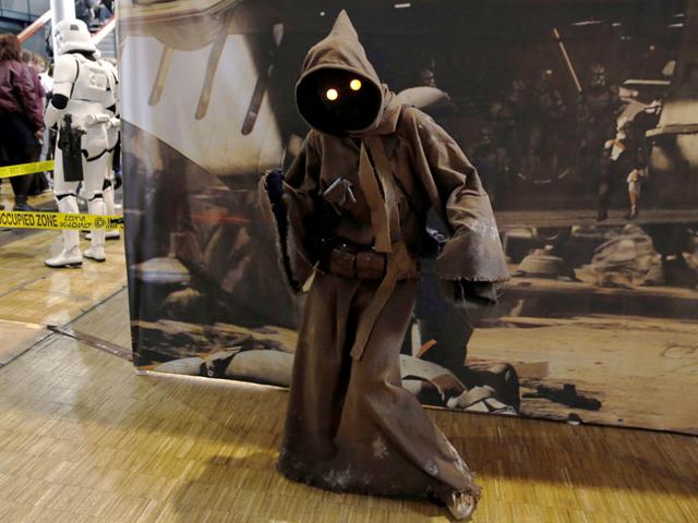 A man dressed up in a Star Wars character poses during the first Comic Con convention on October 23, 2015, in Paris. (AFP)