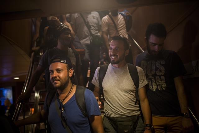 In this Thursday, Sept .10, 2015 photo, Mohammed al-Haj from Syria, center, arrives at Athens' port of Piraeus, Greece. Before his journey, he left his parents 3,000 euros ($3,400) he'd saved up. He left another 8,000 euros with a friend. The friend was to wire Mohammed money if he needed it along the route. But Mohammed also gave him alternative instructions: If he died on his journey, give the money to his mother. (AP Photo) In this Thursday, Sept .10, 2015 photo, Mohammed al-Haj from Syria, center, arrives at Athens' port of Piraeus, Greece. Before his journey, he left his parents 3,000 euros ($3,400) he'd saved up. He left another 8,000 euros with a friend. The friend was to wire Mohammed money if he needed it along the route. But Mohammed also gave him alternative instructions: If he died on his journey, give the money to his mother. (AP Photo)