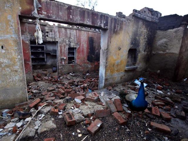 Homes burnt and looted at Bahawadi village in Muzaffarnagar.(Raj K Raj/HT file photo)