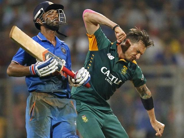 South Africa's Dale Steyn, right, celebrates taking the wicket of India's Ajinkya Rahane during the fifth and final ODI in Mumbai, on October 25, 2015. (Reuters Photo)