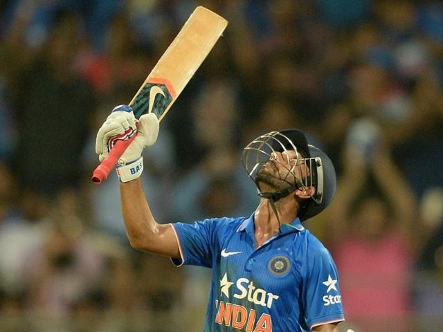 Ajinkya Rahane looks to the heavens in celebration of his half-century. (AFP Photo)