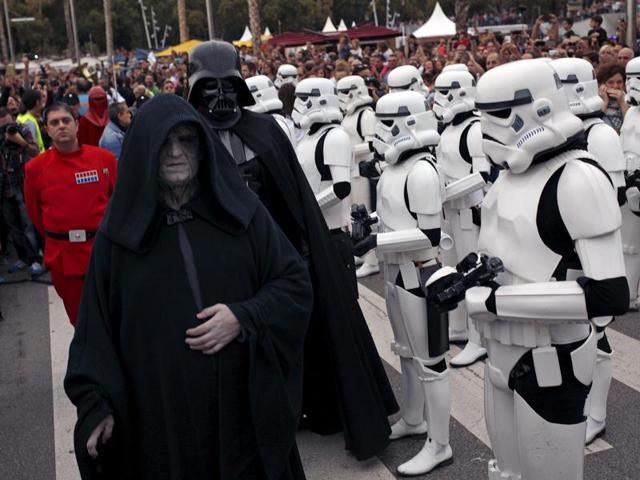 Members of the 501st Legion Spanish Garrison dress up as Emperor Palpatine and Darth Vader, review troops of Stormtroopers in a parade for cancer awareness in Spain. (REUTERS)