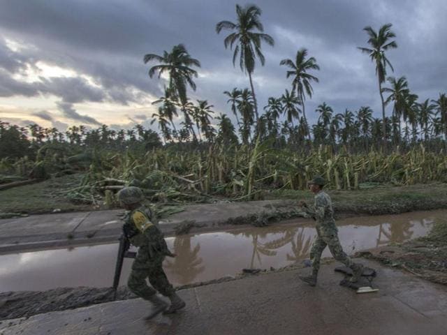 Mexican soldiers patrol looking for people who ask for help after the passage of hurricane Patricia in El Rebalse community, Mexico on October 24, 2015. Patricia flattened dozens of homes on Mexico's Pacific coast, but authorities said Saturday the record-breaking hurricane largely spared the country as it weakened to a tropical depression. (AFP Photo) Mexican soldiers patrol looking for people who ask for help after the passage of hurricane Patricia in El Rebalse community, Mexico on October 24, 2015. Patricia flattened dozens of homes on Mexico's Pacific coast, but authorities said Saturday the record-breaking hurricane largely spared the country as it weakened to a tropical depression. (AFP Photo)