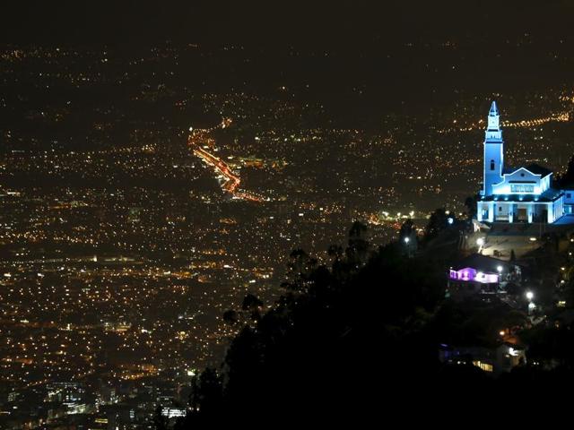 Monserrate mountain and its church are pictured as the building is lit up in blue to honor the 70th anniversary of the United Nations in Bogota, Colombia (REUTERS Photo) Monserrate mountain and its church are pictured as the building is lit up in blue to honor the 70th anniversary of the United Nations in Bogota, Colombia (REUTERS Photo)