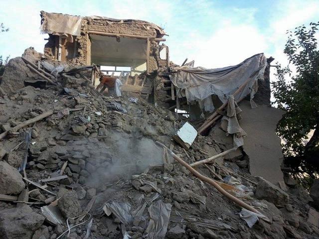 An Afghan man digs through the rubble of a damaged building in Ramankheel village in Panjshir valley after a powerful 7.5-magnitude earthquake in northern Afghanistan rocked cities across South Asia. (AFP)