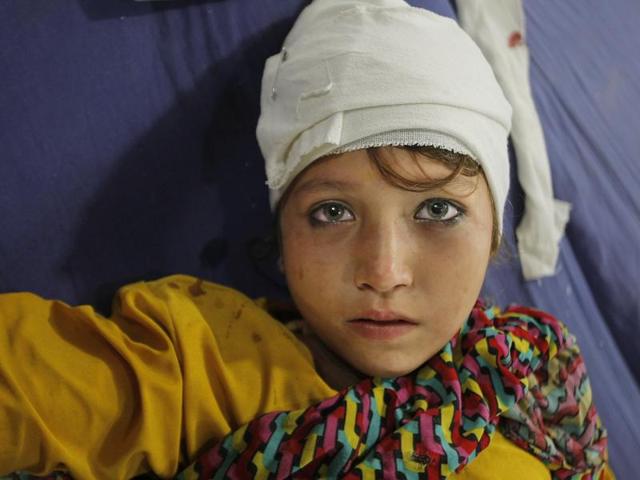 A girl injured from an earthquake admits at a local hospital in Peshawar, Pakistan. (AP)