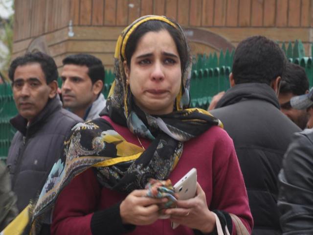 A woman cries after an earthquake measuring 7.5 on the Richter scale was felt in Kashmir. There were no reports of casualties, but there was a major damage to property in the Valley. (HT Photo)